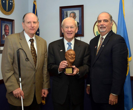 Chairperson J. Anthony Poleo (right) and Vice Chairperson James A. Kesteloot (left) with recipient Michael Gilliam (center).